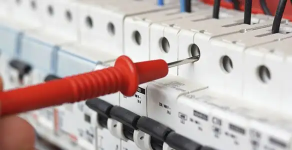 Electrical contractor testing circuit breakers during electrical repair in French Gulch, CA