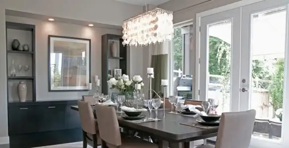 Elegant dining room chandelier installation above table in Redding, CA