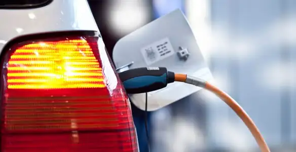 Electric car plugged into EV charger after professional installation in Redding, CA