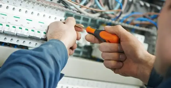 electrical service showing licensed electrician performing electrical panel maintenance and adjustments in Redding, CA