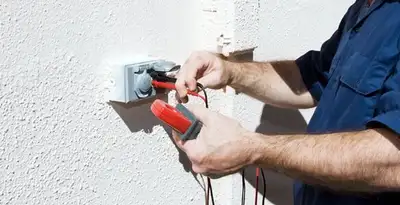 Electrician performing home electrical outlet and wiring inspection in Redding, CA