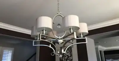 Modern chandelier installation with multiple light fixtures in Redding, CA