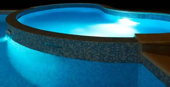 pool light installation and repair services highlighting illuminated pool interior lighting in Redding, CA