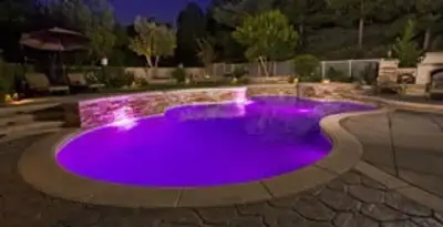 pool light installation and repair services illuminating a residential swimming pool in Redding, CA