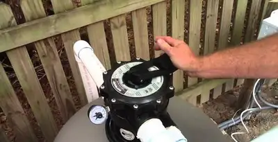 pool pumps service showing professional adjustment of pool pump control system in Redding, CA