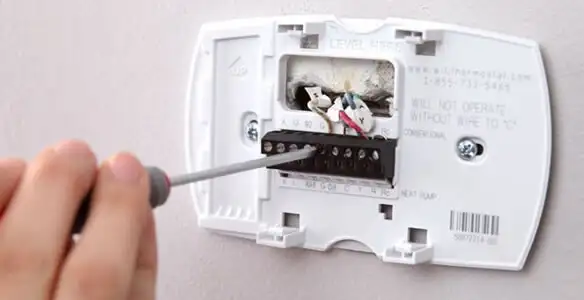 Thermostat installation service with proper wiring and secure wall mounting in Redding, CA