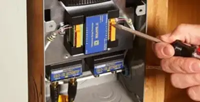 Whole home surge protection device being installed by a licensed electrician to protect electrical systems in Redding, CA